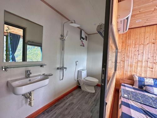 a bathroom with a sink and a toilet at Valley Bungalow - Venuestay in Tam Ðảo