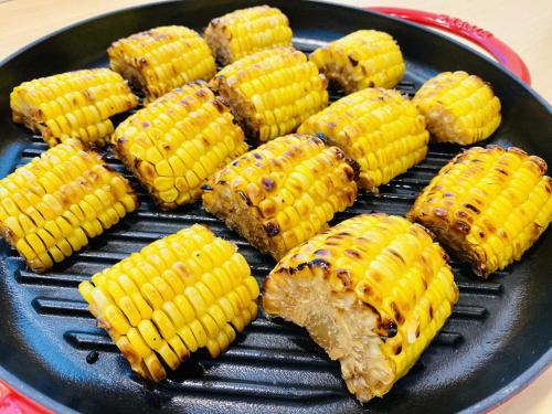 a bunch of corn on a black grill at Tmark City Hotel Sapporo in Sapporo