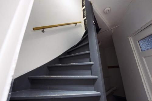 a staircase leading up to the top of a house at City Suite Number 4 in Eindhoven
