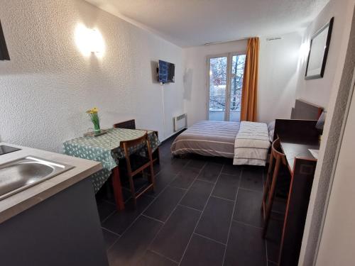 Postel nebo postele na pokoji v ubytování Appart Hotel La Defense