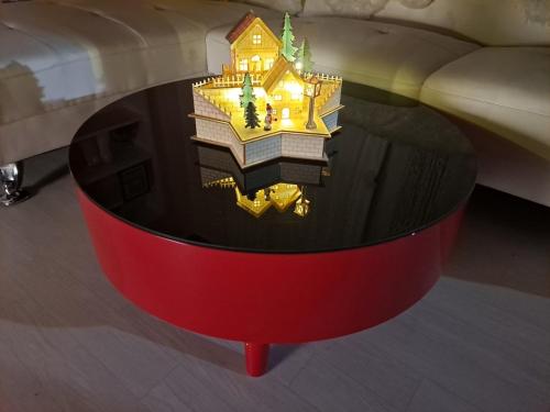 a red coffee table with a house on top of it at 복층형 하우스 in Daejeon