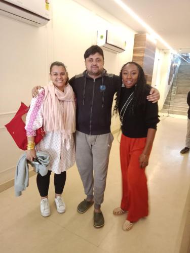 a man and two women posing for a picture at HOTEL SHYAM PALACE INDIA AGRA in Agra