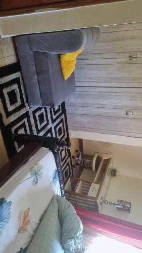a room with a bed with a mirror and a ceiling at Cloud Air in Kampala