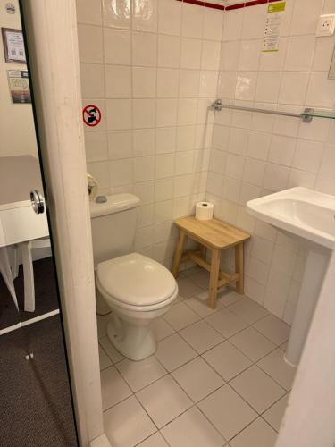 a bathroom with a toilet and a sink at Hotel Des Grands Hommes - Bordeaux Centre in Bordeaux