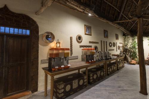 a room with a table with some food on it at Kiwengwa Beach Resort in Kiwengwa