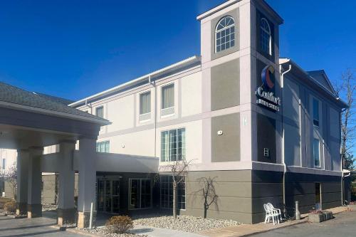 a building with a clock tower on the side of it at Comfort Inn & Suites Mount Pocono in Mount Pocono