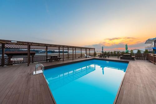 a large swimming pool on top of a building at Ganghwa Granblue Pension in Incheon