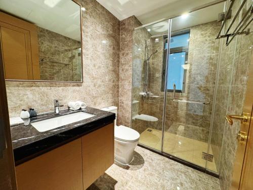 a bathroom with a toilet and a sink and a shower at TheBess Hotel Tokyo is located adjacent to Singapore and offers a sea viewIt is a family business smart room with the sea view of Princess Bay富力公主湾 in Johor Bahru