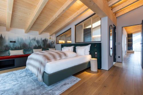 Postel nebo postele na pokoji v ubytování Hotel Madlein