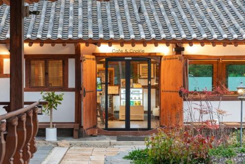 an entrance to a store with the door open at Gangneung Mokgawon in Kangmun