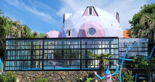 a building with people in front of it at Atto Pension in Sinhŭng il-li