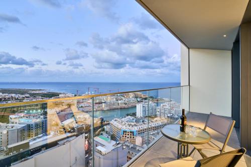 a balcony with a view of the ocean at Sky High Luxury Apartment in Mercury Towers with Infinite Seaviews in St. Julianʼs