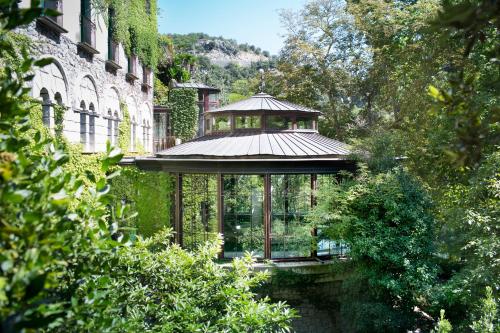 a gazebo in the middle of a building at Le Grand Hôtel in Molitg les Bains