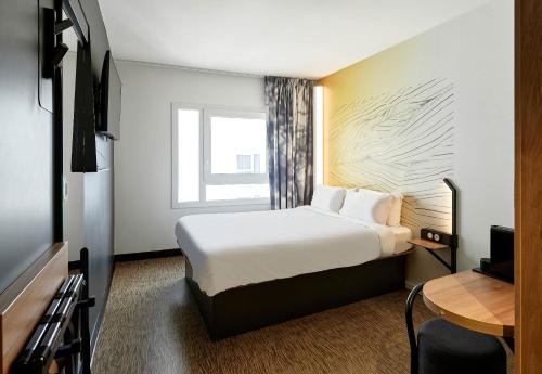 Postel nebo postele na pokoji v ubytování B&B HOTEL Paris Ivry Quai de Seine