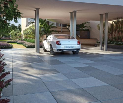 a white car parked in front of a house at Regenta Central Hestia Dahej, Bhensali in Dahej