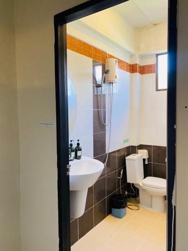 a bathroom with a sink and a toilet at Beach House 24 in Ko Lanta