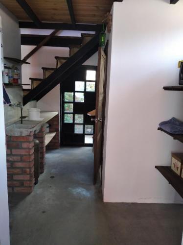 an open door to a kitchen in a house at Posada María E in Mucuchíes