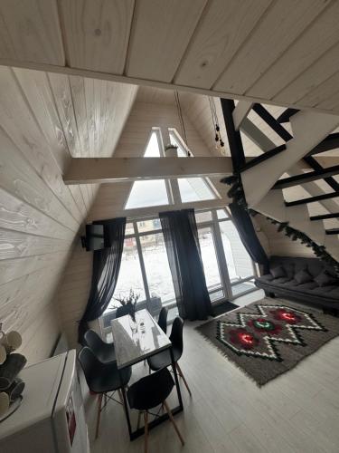 an overhead view of a living room with a table and chairs at Шале WeLKoMe in Verkhovyna