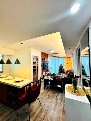 a living room with a couch and a table at Holiday Escape Philippines in Manila