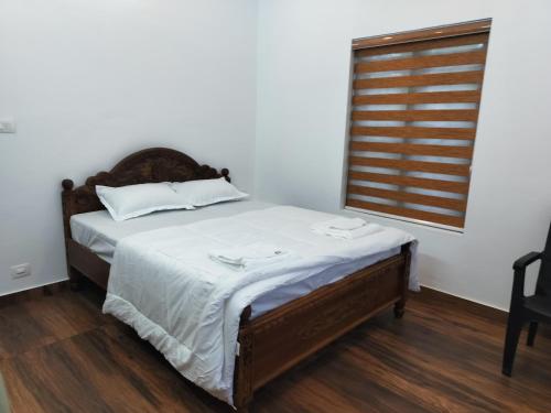 Ένα ή περισσότερα κρεβάτια σε δωμάτιο στο Roneys Villa