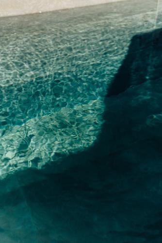 a close up of the ocean water at Erthā Suites with private pools in Vóthon