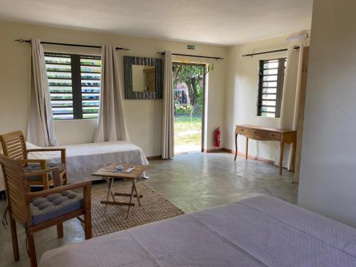 Postel nebo postele na pokoji v ubytování Le Jardin de Beau Vallon