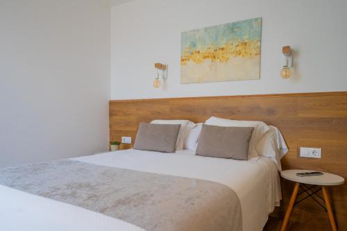 Postel nebo postele na pokoji v ubytování Hostal Menurka