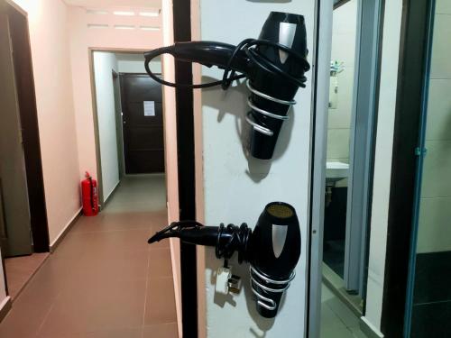 a pair of binoculars hanging on a door at 1813 HOME STAY 8 Roon 6 Bath 5MINUTE TO LEANING TOWER in Teluk Intan