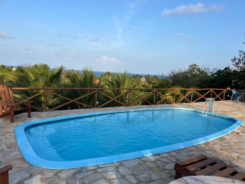 a swimming pool in the middle of a yard at Pipa Golfinhos Pousada in Pipa