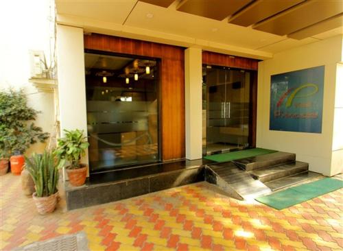 a lobby of a building with a pool table at Hotel Princess in Ankleshwar