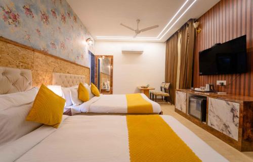 Postel nebo postele na pokoji v ubytování Hotel Royal Paradise