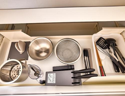 a drawer filled with pots and pans and other kitchen utensils at APRO STAY FujiKawaguchiko-Kotobuki13 in Fujiyoshida