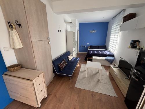 a small living room with a couch and a table at Grupo Gontad Apartamento Mourelle Corme in Corme-Puerto