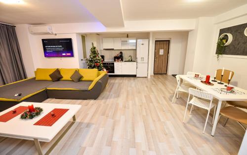 a living room with a couch and a table at Bucharest Accommodation Apartments in Bucharest