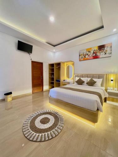 Giường trong phòng chung tại Harmonia batur villa