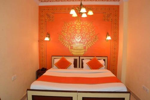 Un ou plusieurs lits dans un hébergement de l'établissement Hotel Golden Heritage Deluxe