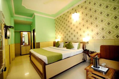 Un ou plusieurs lits dans un hébergement de l'établissement Hotel Golden Heritage Deluxe