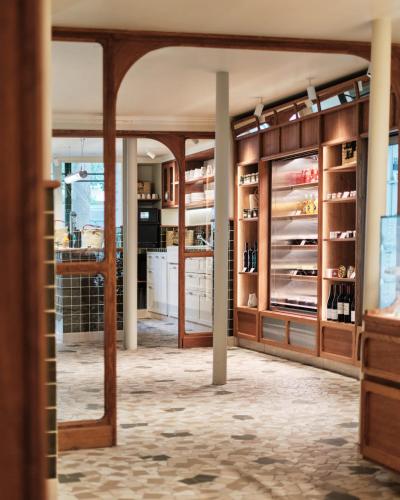 a large room with a store with glass doors at 1.75 Paris La Trêve in Paris