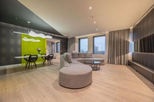 a living room with a couch and a table at Park Inn by Radisson Amsterdam City West in Amsterdam
