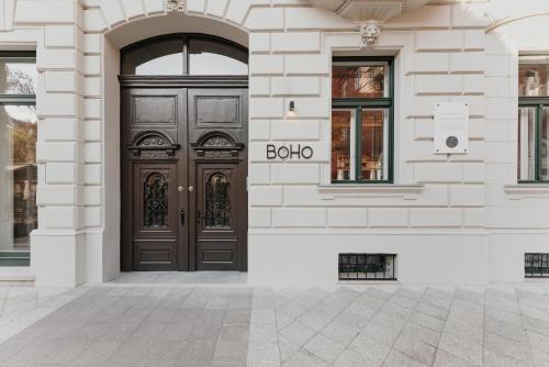 a brown door on the side of a building at BoHo Hotel Budapest - Small Luxury Hotels in Budapest