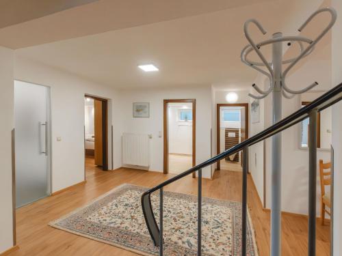 a staircase in a home with white walls at Holiday Home Riki by Interhome in Bruck an der Großglocknerstraße