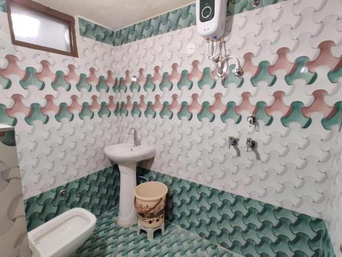 a bathroom with a toilet and a sink at Tejas dream house 4 minute away from Golden Temple in Amritsar