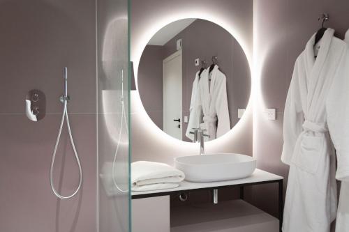a bathroom with a sink and a mirror at 1.75 Paris La Source in Paris