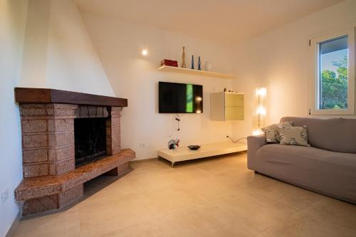 TV a/nebo společenská místnost v ubytování Villa Dei Pini