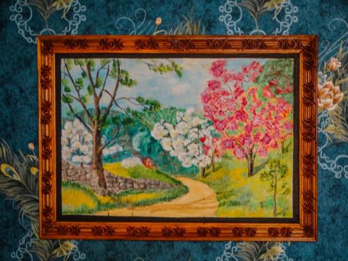 a picture of a painting of a path with flowers at Misba Homestay Kodai in Kodaikānāl