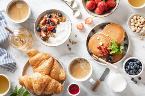 a table topped with breakfast foods and coffee and croissants at Radisson Hotel Tunis, City Center in Tunis