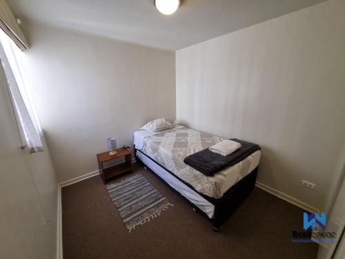 Postel nebo postele na pokoji v ubytování Departamento Corporativo I Talca Norte - RENTCOVAC - Factura Inmediata