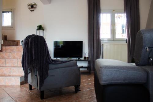 TV a/nebo společenská místnost v ubytování EMVI APARTMENTS VI near airport