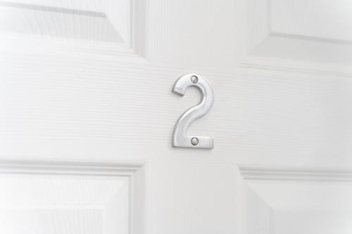 a towel hook on a door with a swan on it at Open Mind Property - Cosy Apartment with 3 Beds in Portsmouth