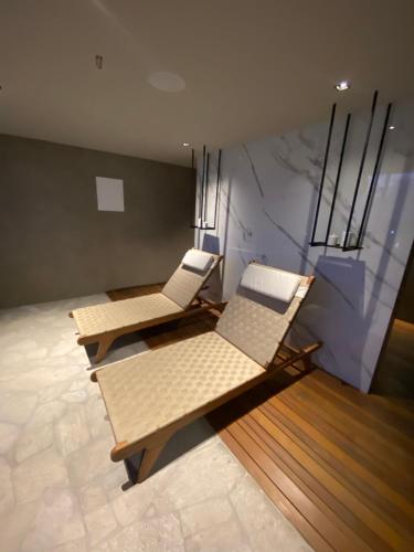 two chairs and a couch in a room at New time 1216 in Maceió